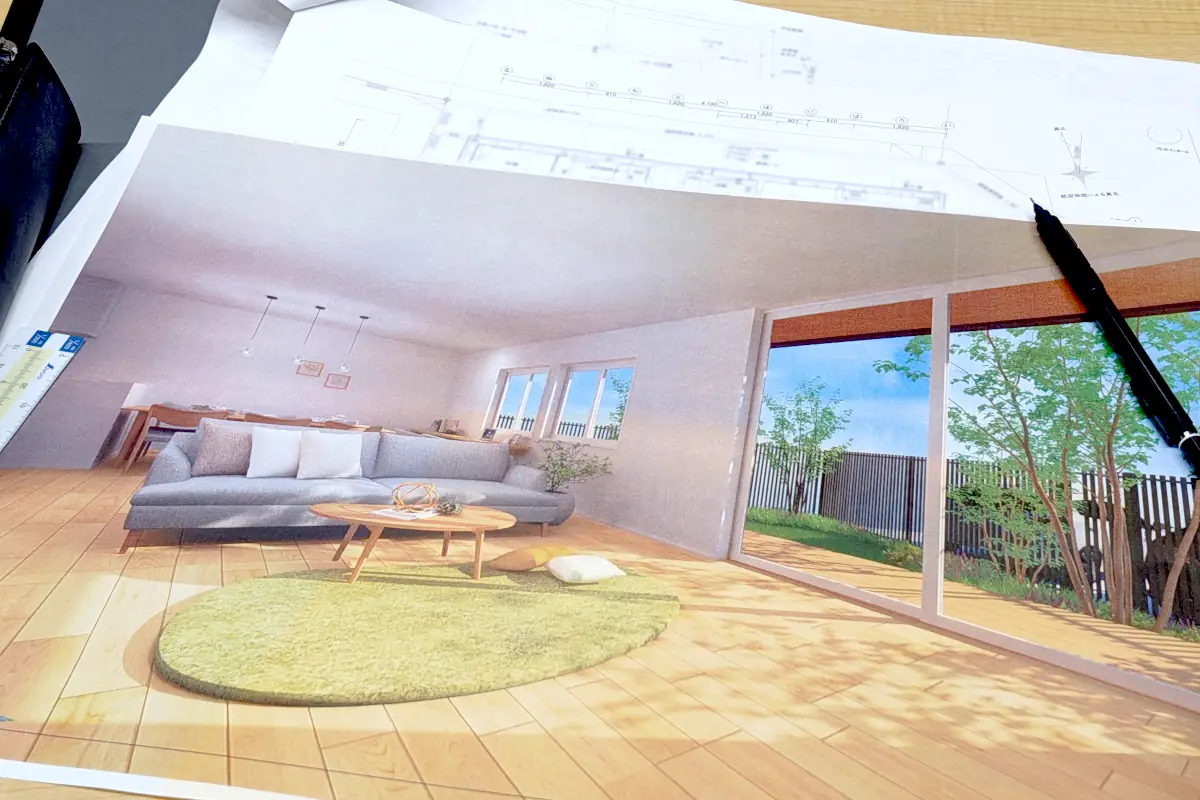 明るいリビングの完成予想パースと、その上に重ねられた緻密な建築図面